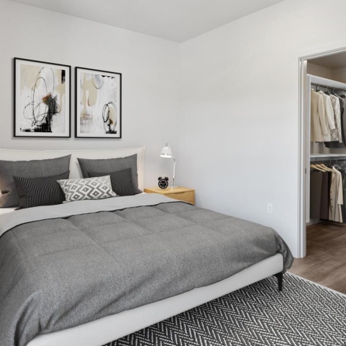 a bedroom with a bed and a fan
