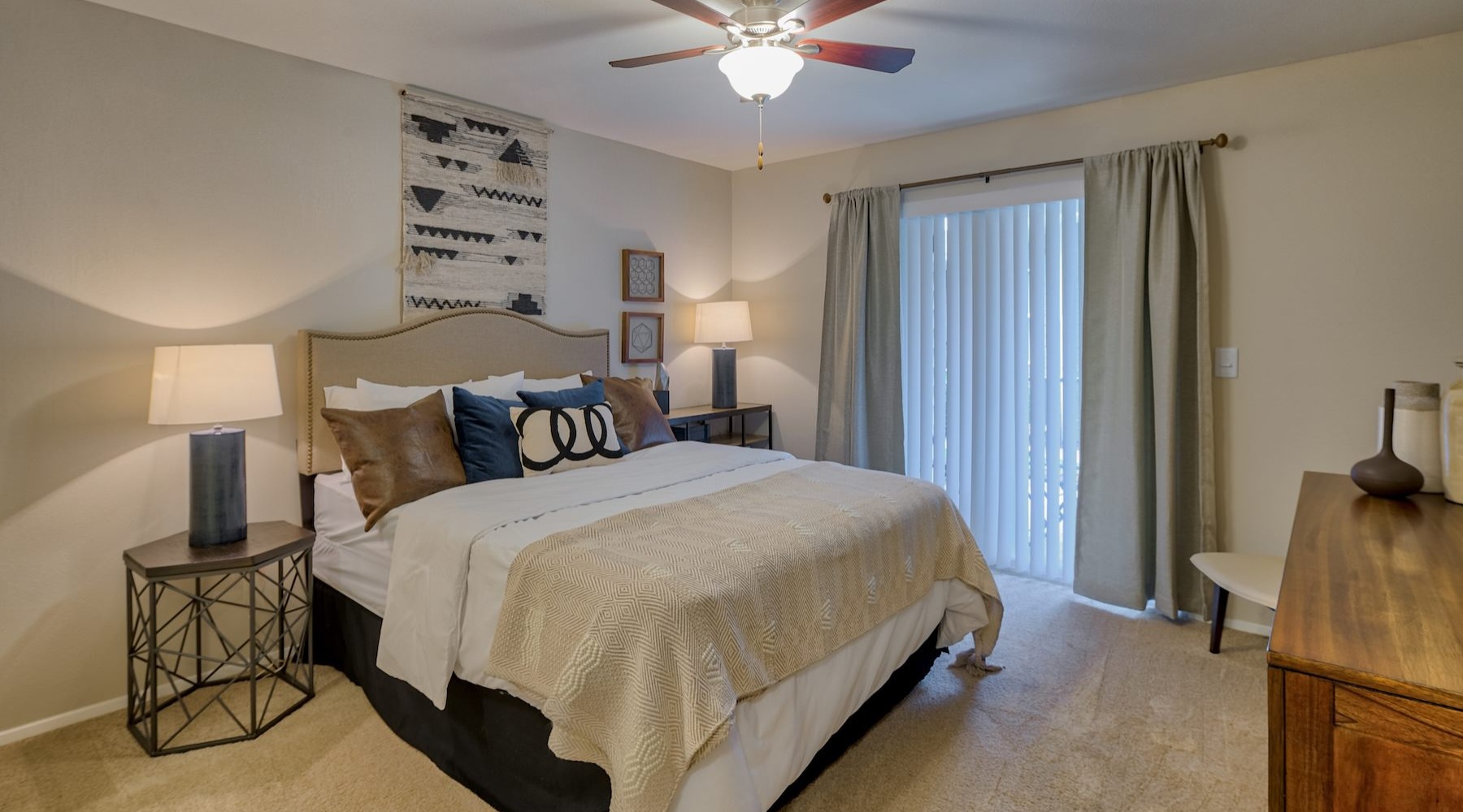 a bedroom with a bed and two nightstands